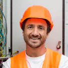 Fix Pro AE technician in an orange hard hat and safety vest
